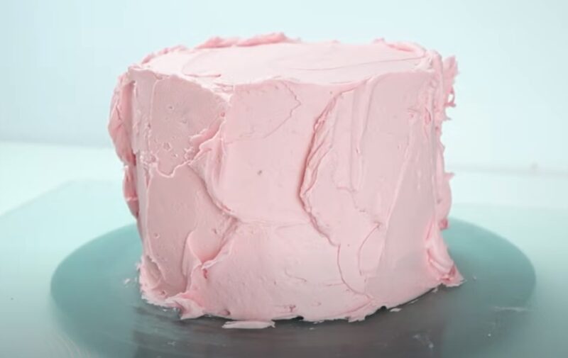 Yellow Birthday Cake with Fluffy Pink Frosting A Personal Touch